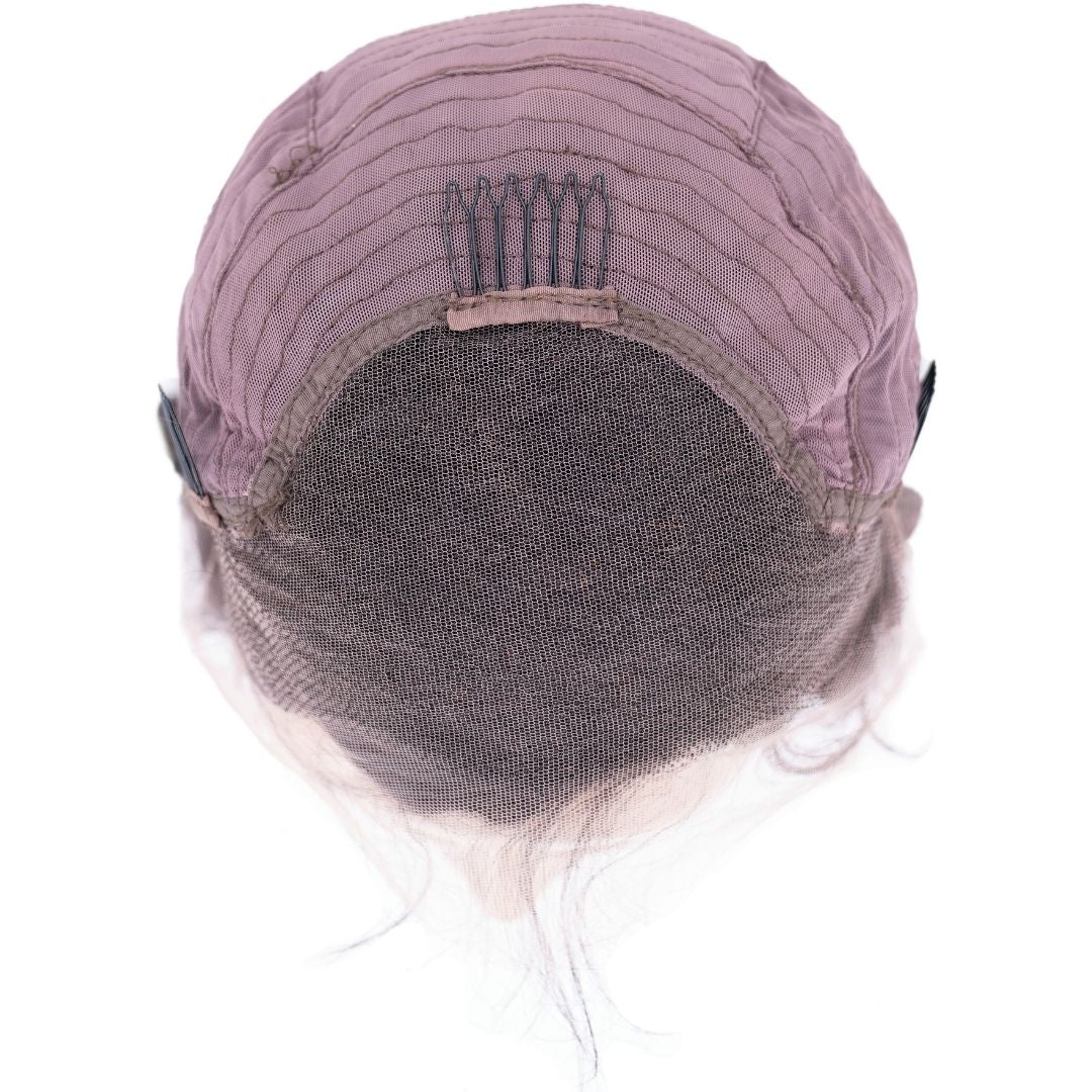 Close-up view of the HD Deep Wave Lace Front Wig cap by hairdiamondz, highlighting its interior structure such as light brown mesh netting, combs, and elastic bands designed to secure the wig in place. The stitching is visible along the top.